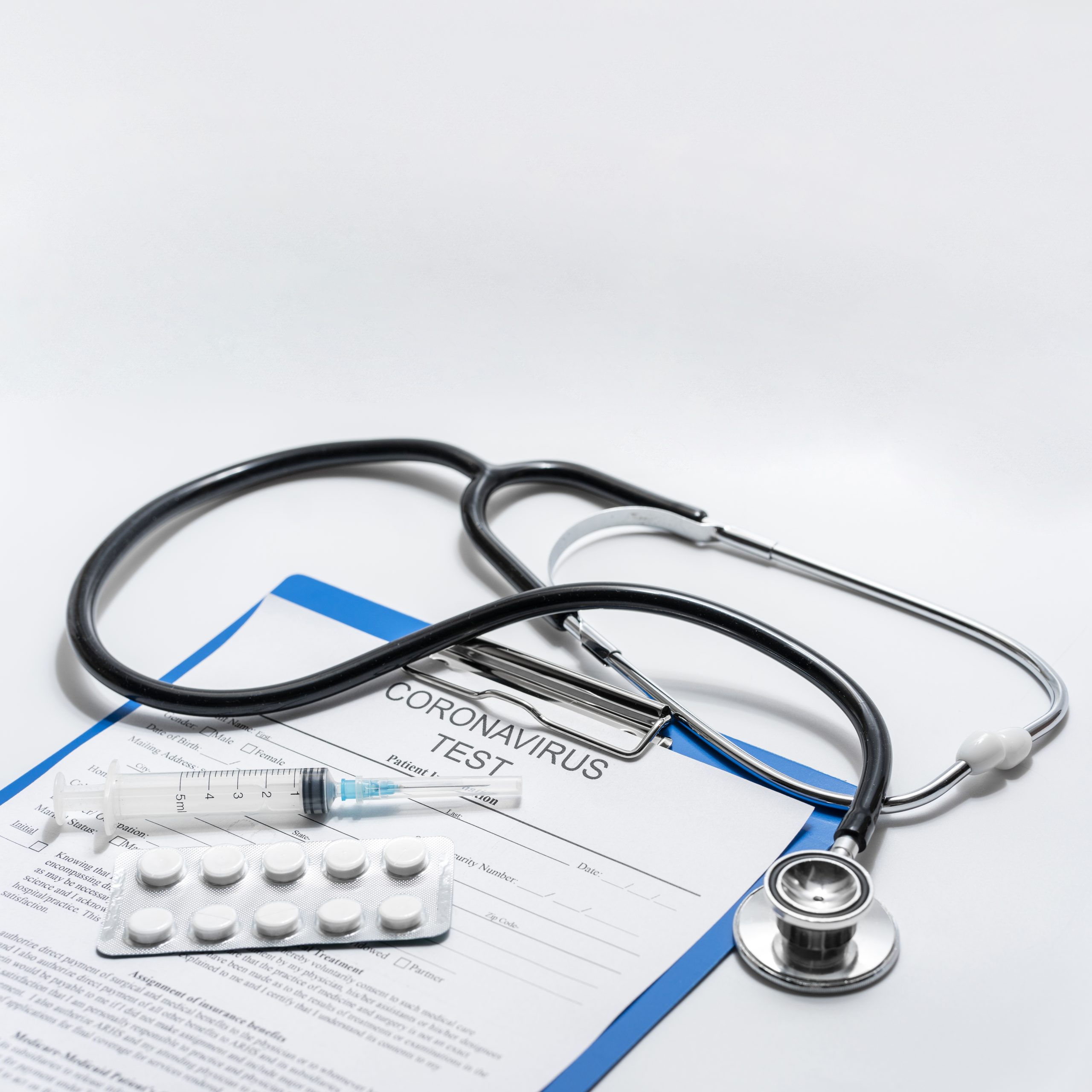 close-up-stethoscope-with-tablets-medical-form